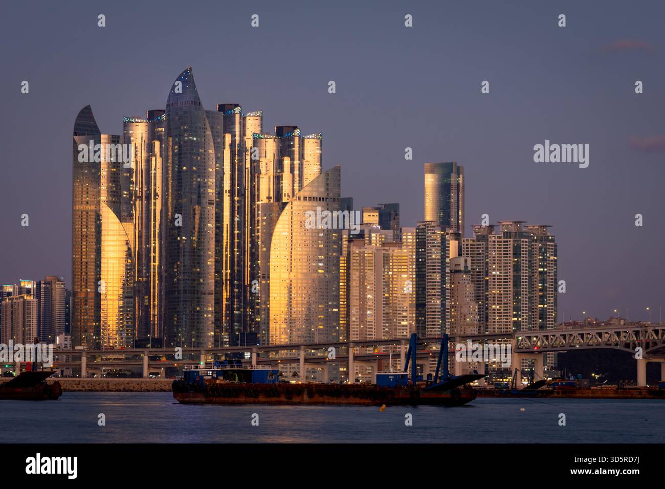 Beautiful skyscraper complex along a beach in Gwangan-li Busan, South Korea. Photo taken during sunset Stock Photo