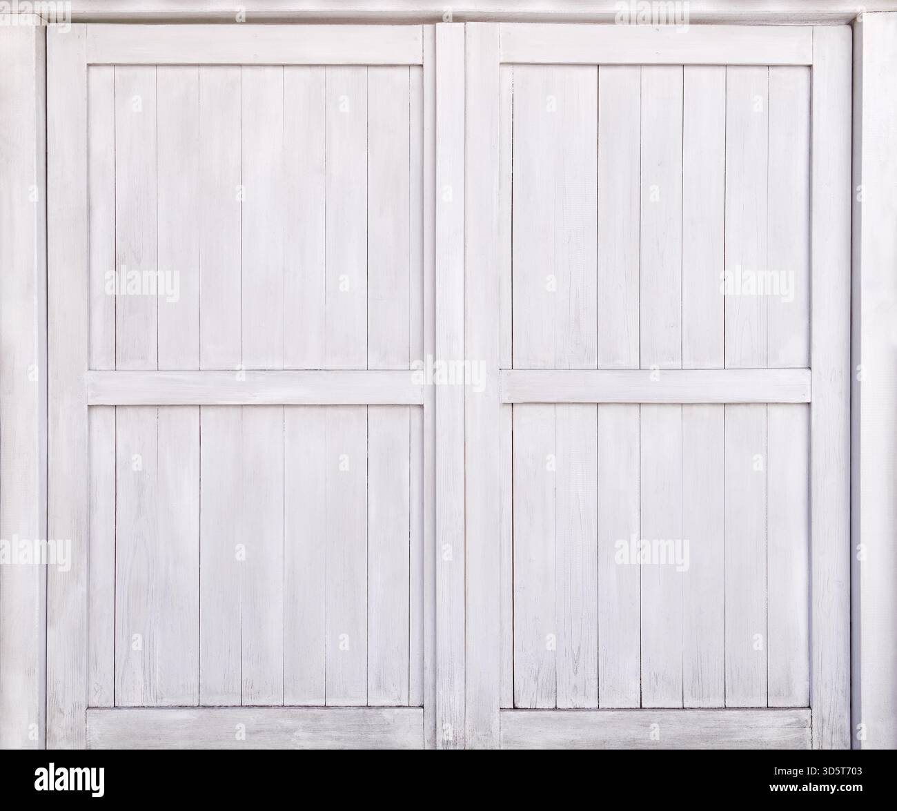 Closed white wooden gate in close-up Stock Photo