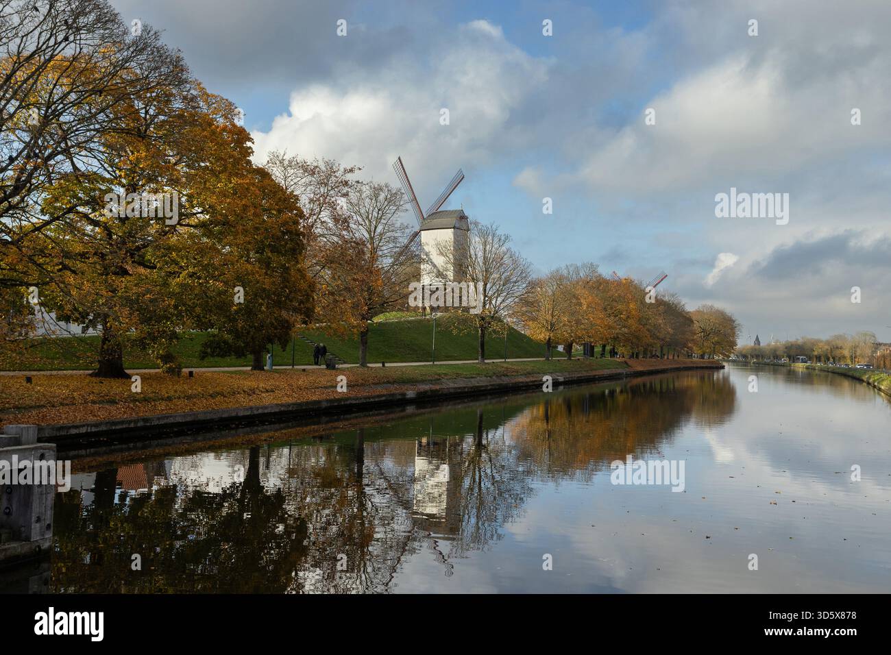 Beautiful Autumn View of Kruisvest Ramparts and Bonne-Chière Mill in Bruges, West Flanders, Belgium. Copy space above. - Stock Image