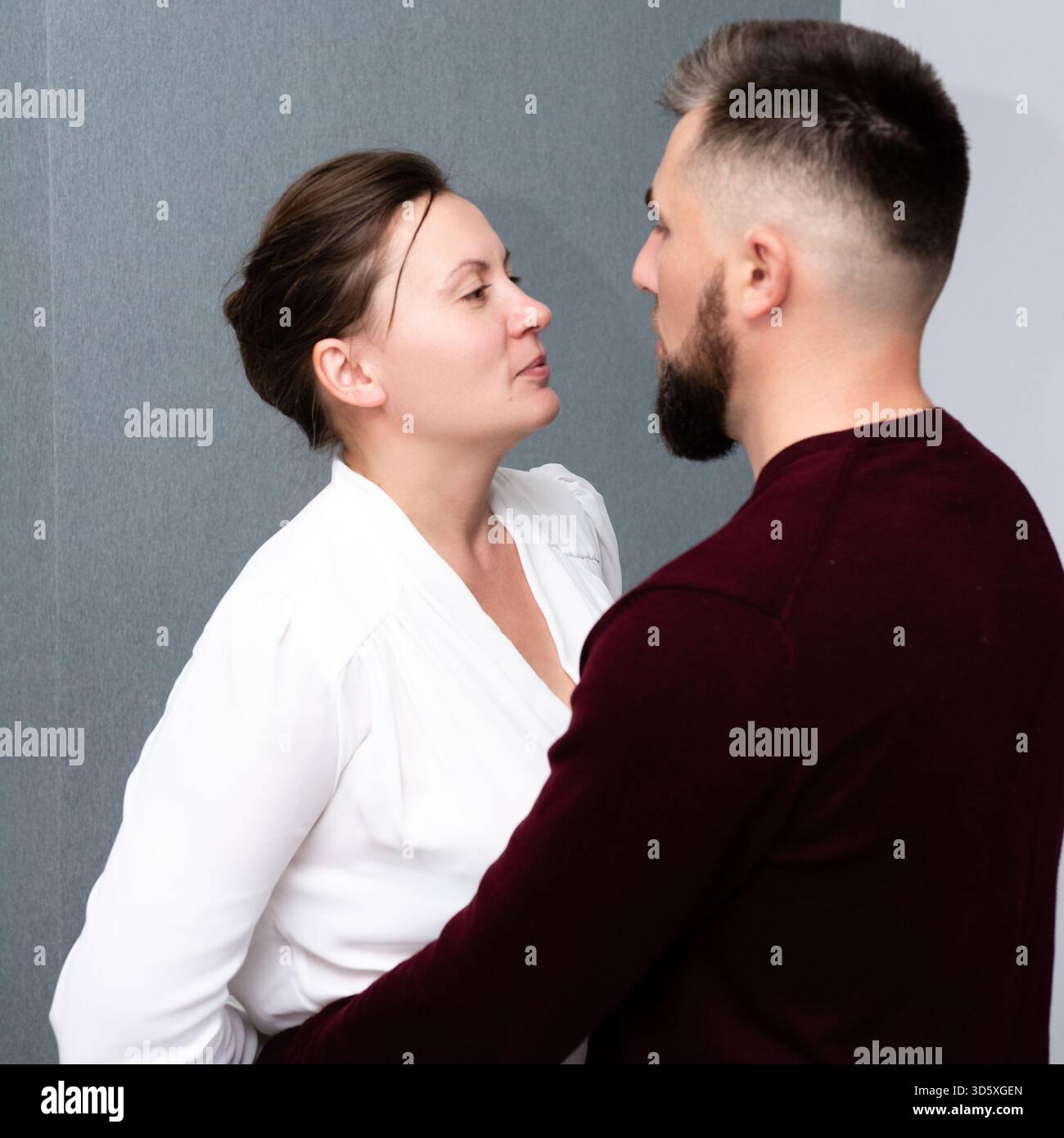 Deeply Engage Two individuals engage in a deep and intense moment, locked in a gaze ...