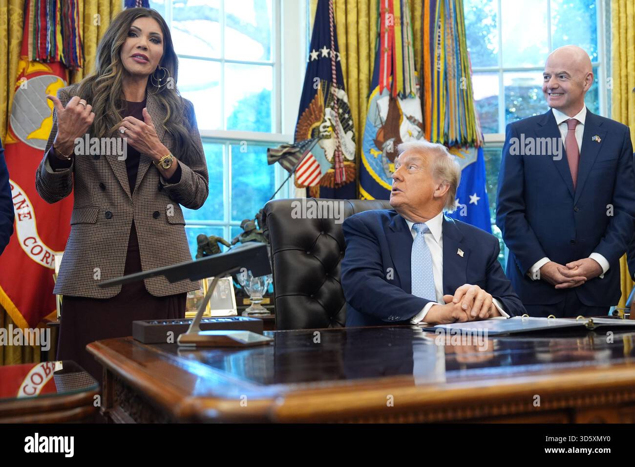 President Donald Trump and FIFA President Gianni Infantino listen as