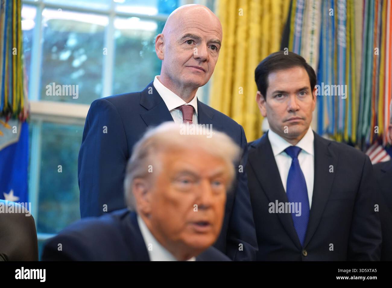 President Donald Trump answers questions from reporters during a