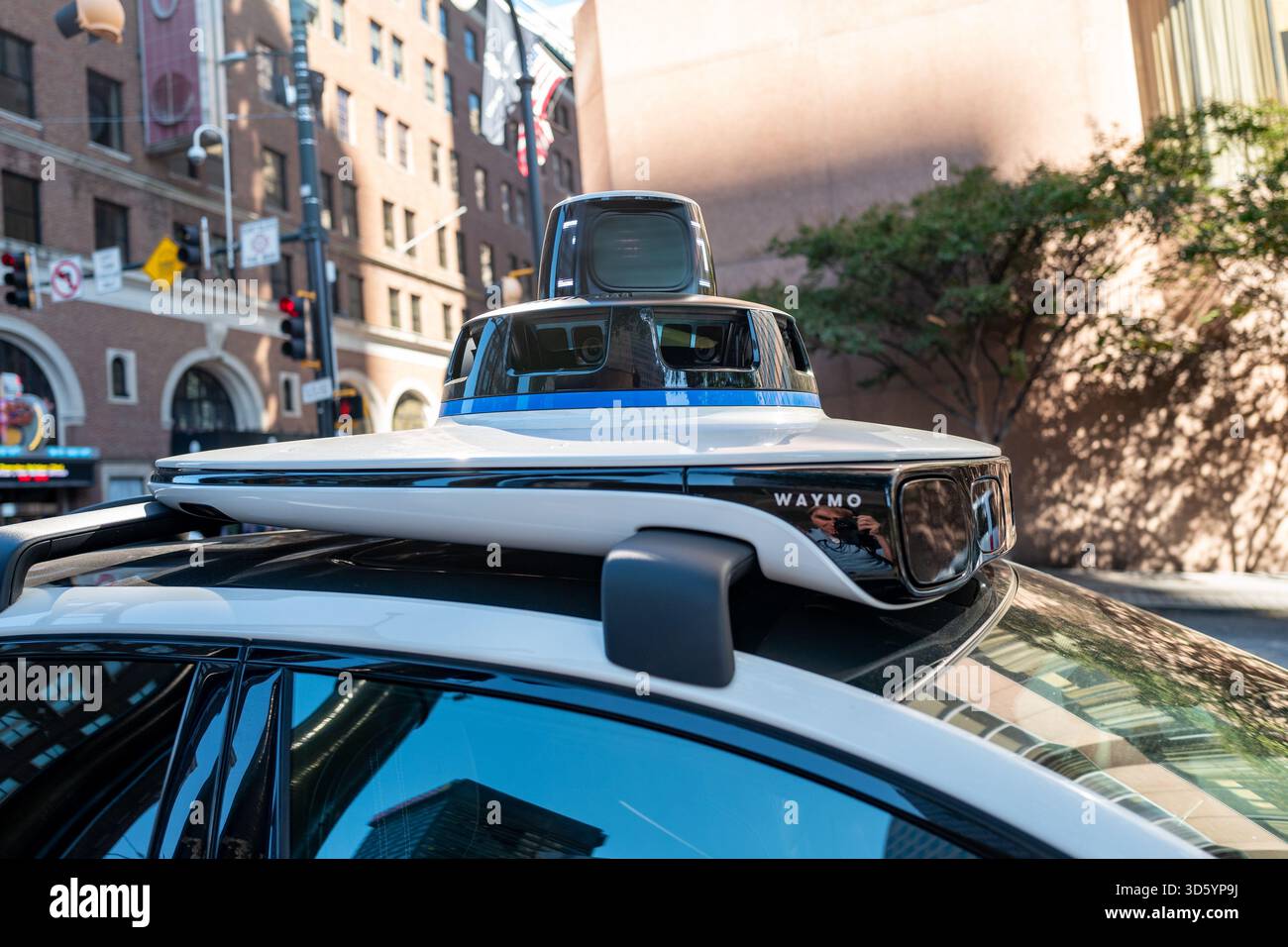 Close-up of LIDAR unit and sensors atop Waymo self-driving vehicle ...