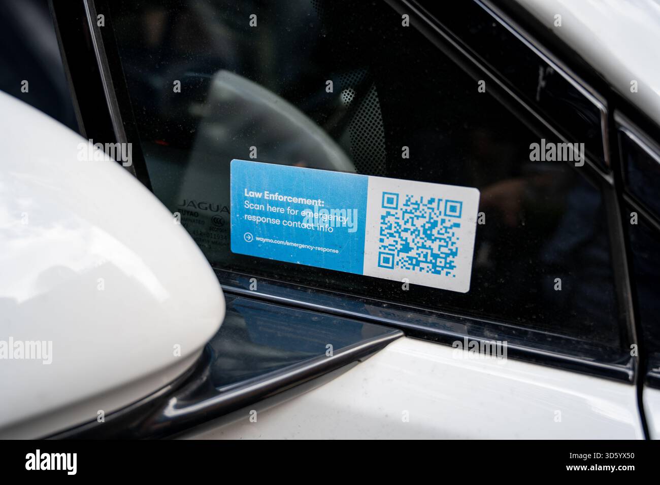 Close-up of Waymo emergency response QR code sticker for law ...