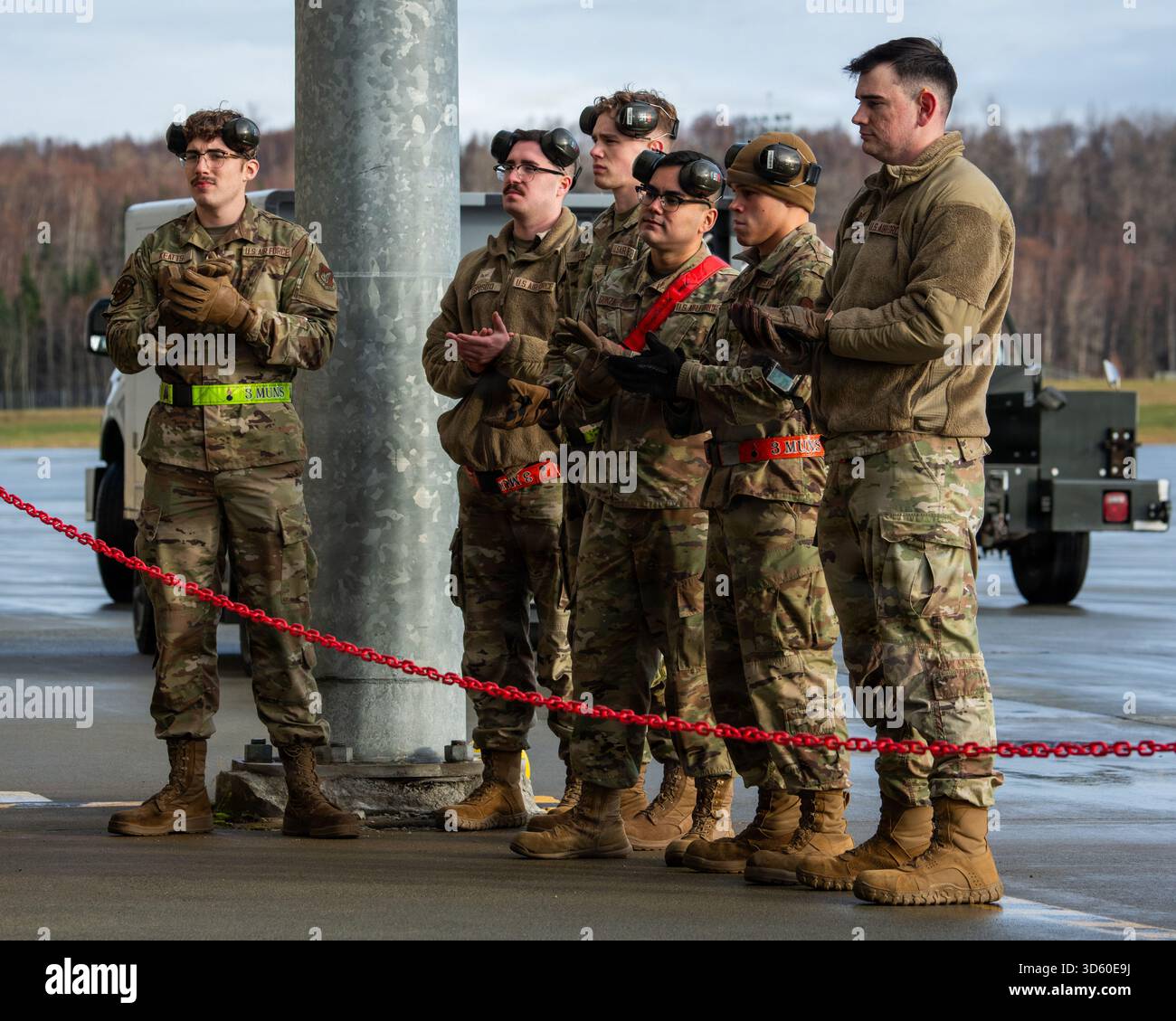 U.S. Air Force Airmen assigned to the 3rd Munitions Squadron wait to ...