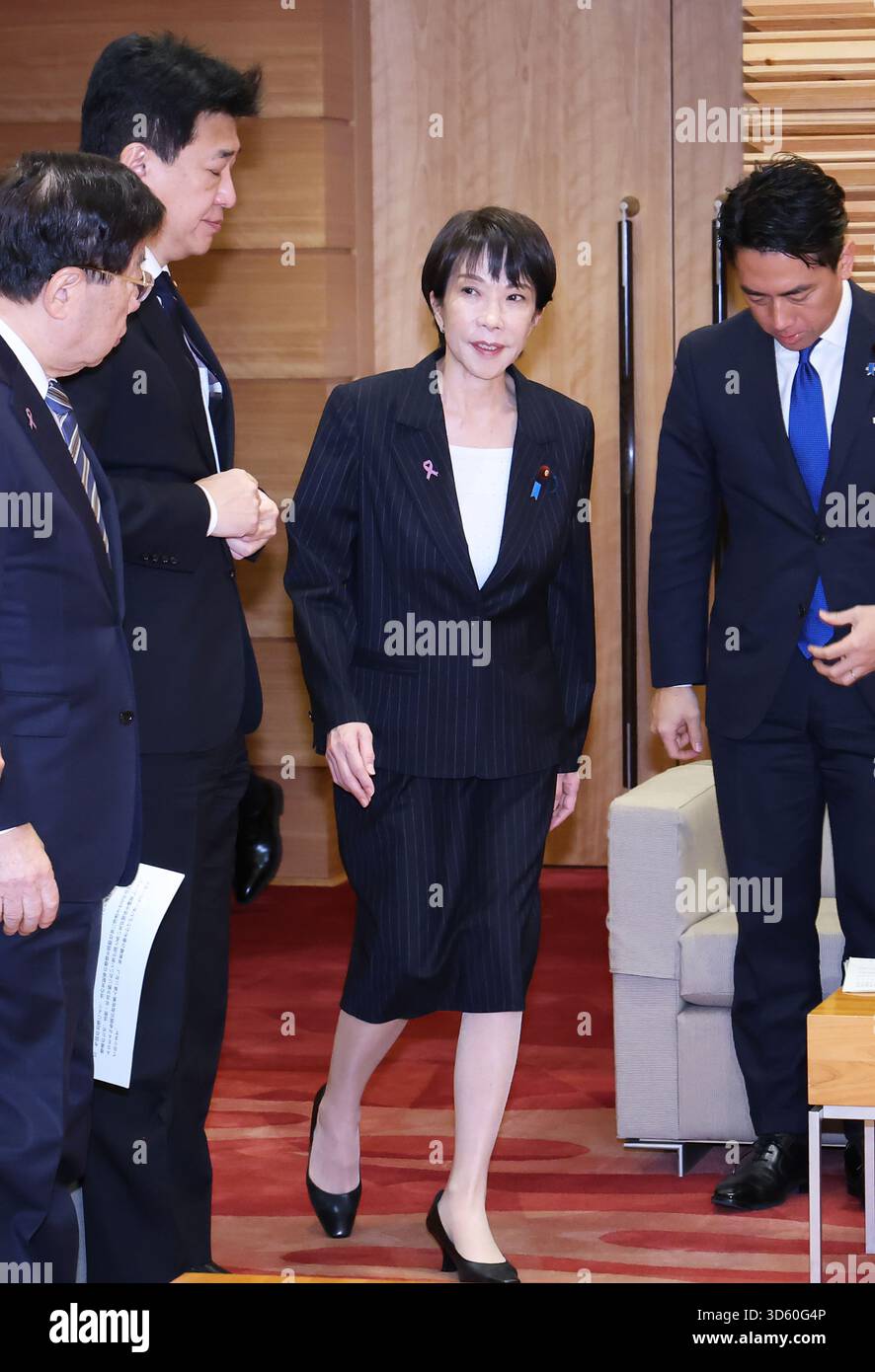 Japanese Prime Minister Sanae Takaichi and other cabinet members attend ...