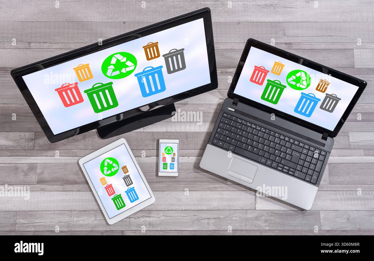Recycling concept shown on different information technology devices Stock Photo