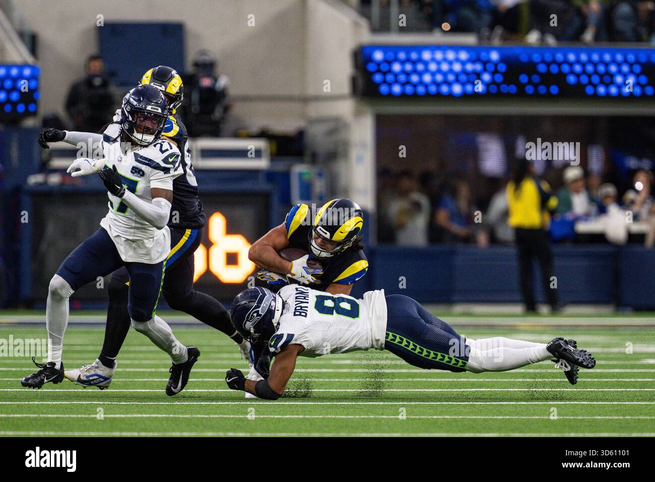 Los Angeles Rams wide receiver Puka Nacua (12) is tackled by Seattle ...