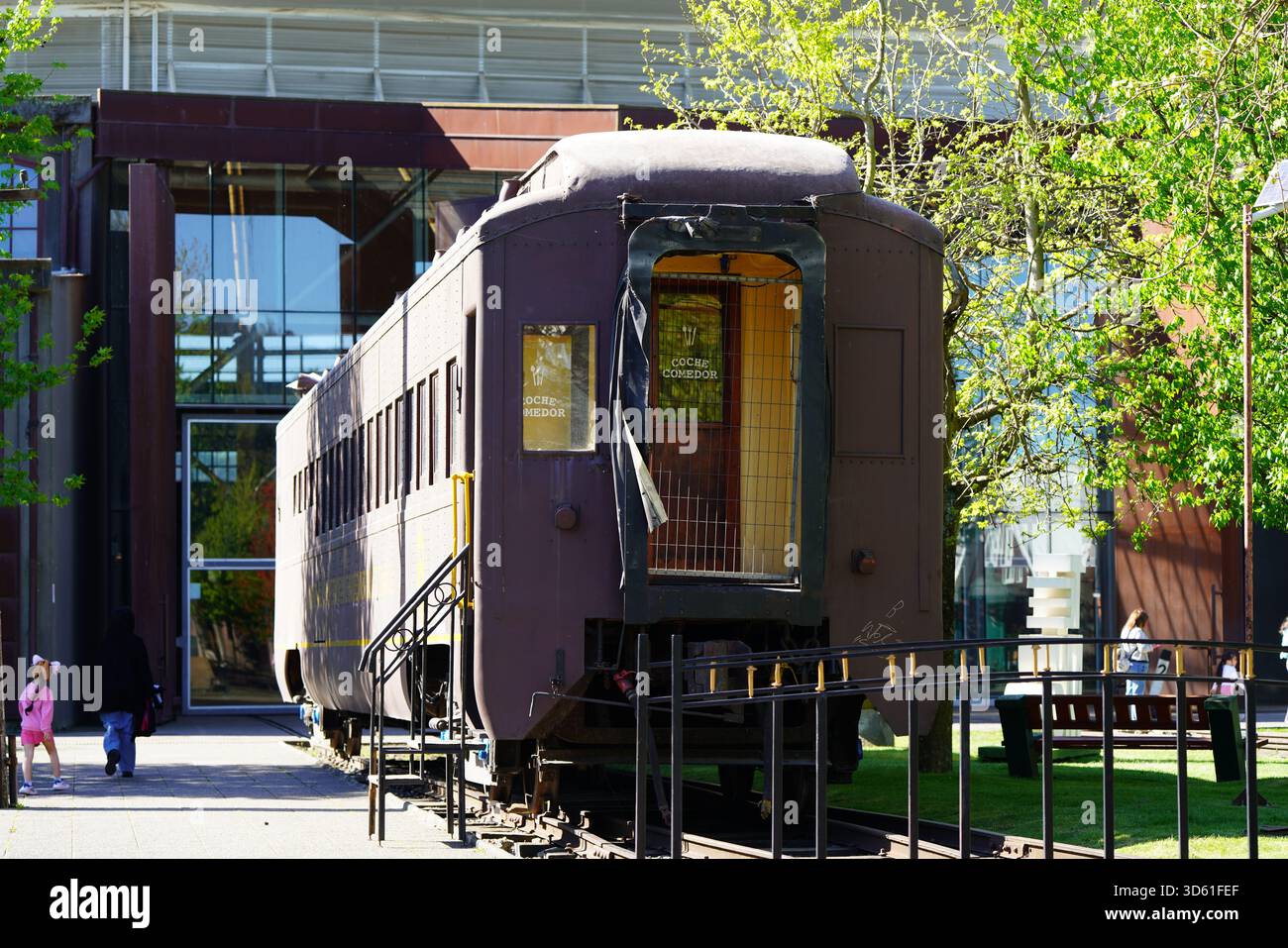 Railway car, food truck at the museum entrance and people around, located at the Pablo Neruda National Railway Museum Stock Photo