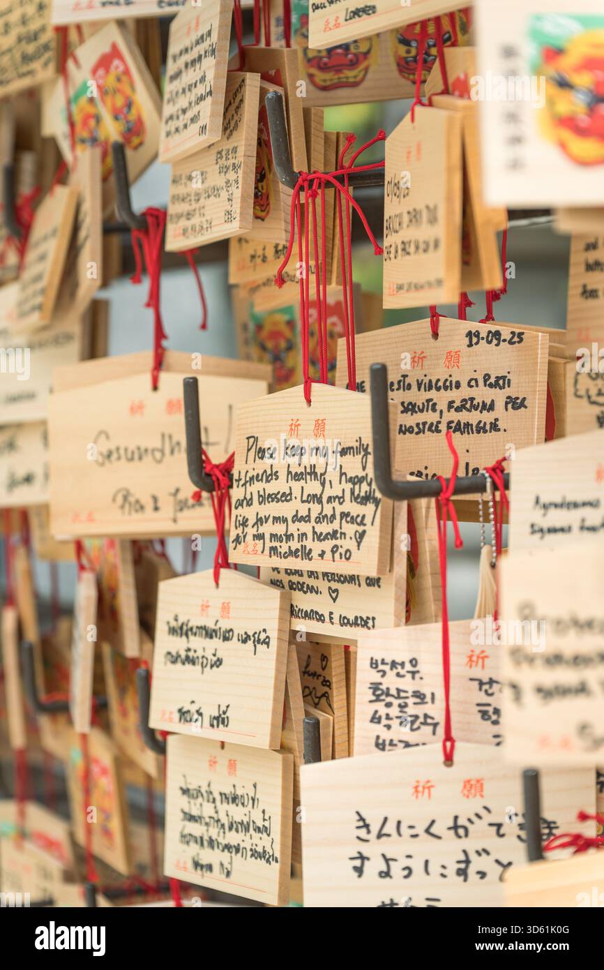 A display of Ema, small prayer plaques with handwritten wishes hanging ...