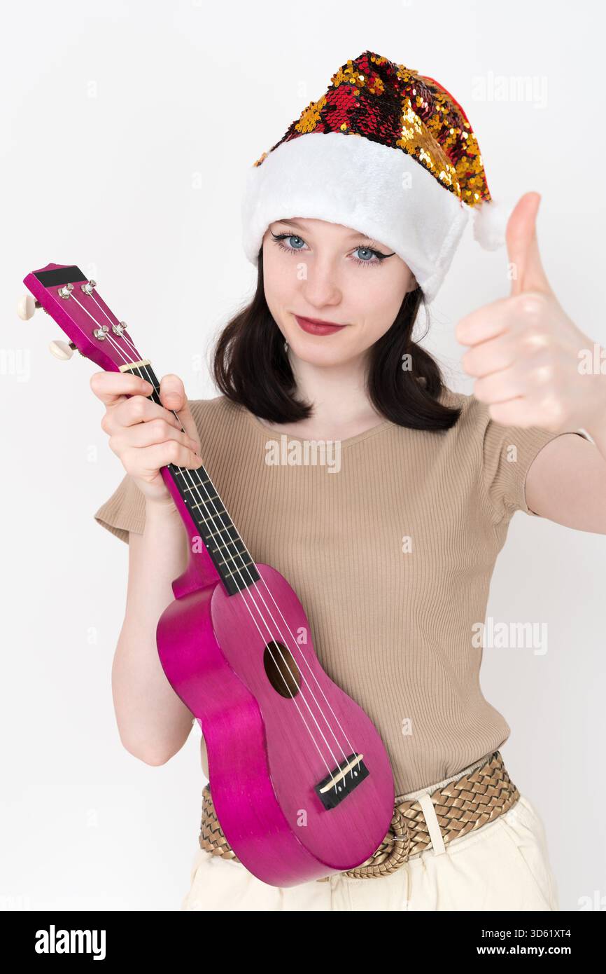 Young musician wearing santa hi-res stock photography and images - Alamy