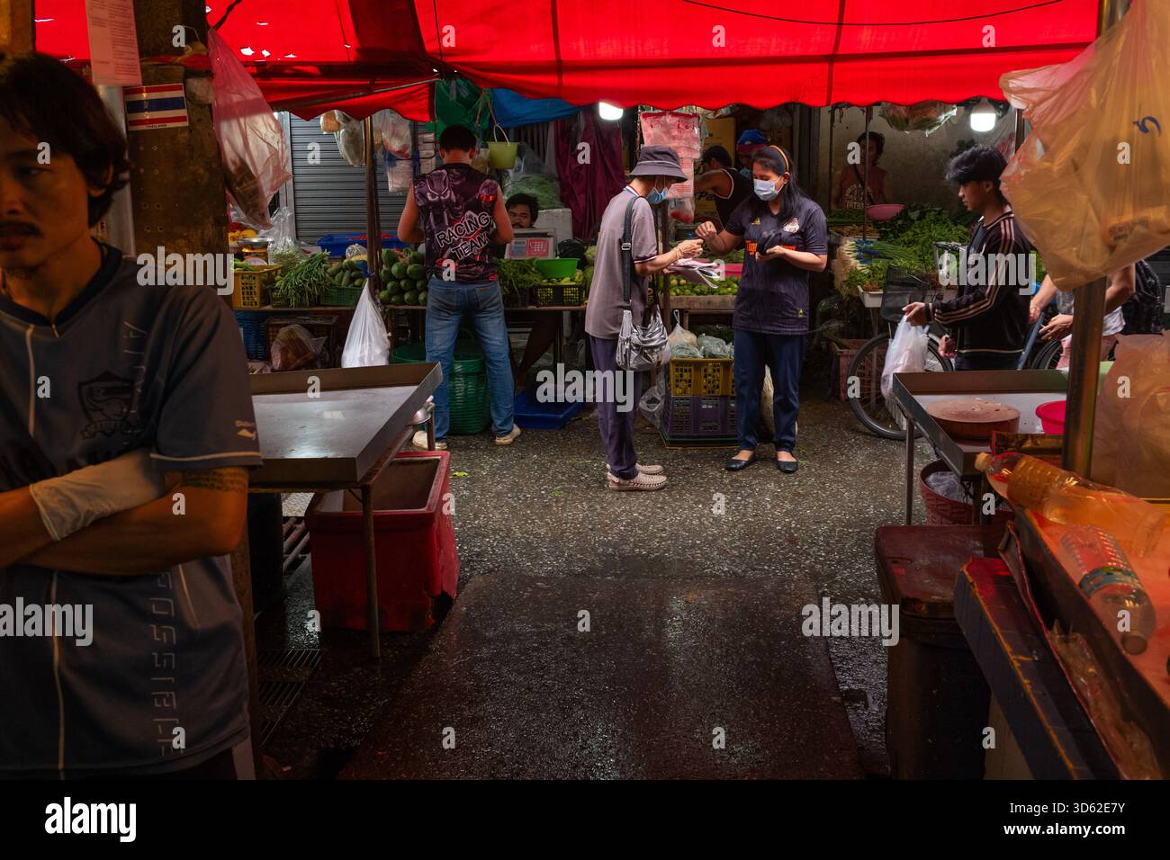 People seen in an alley at Bang Kapi Fresh Market. (Photo by Patrick ...