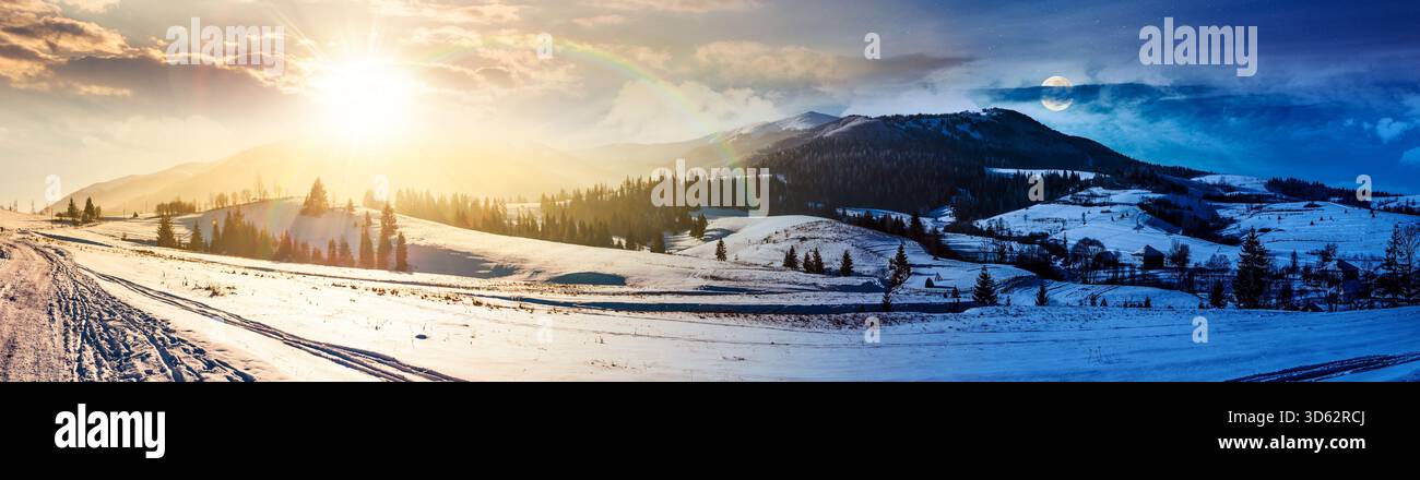 forested valley near village. day and night time change concept. landscape panorama with mountain ridge in winter with sun and moon. snow covered rura Stock Photo