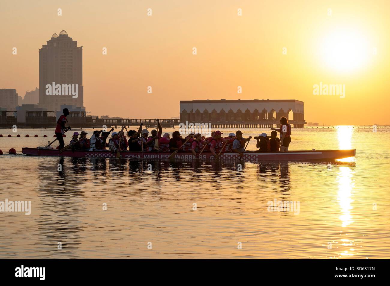 Doha, Qatar - October 24, 2025: Silhouette people rowing dragon boat at ...
