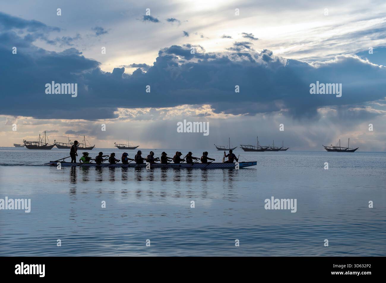 Doha, Qatar - October 24, 2025: Silhouette people rowing dragon boat at ...