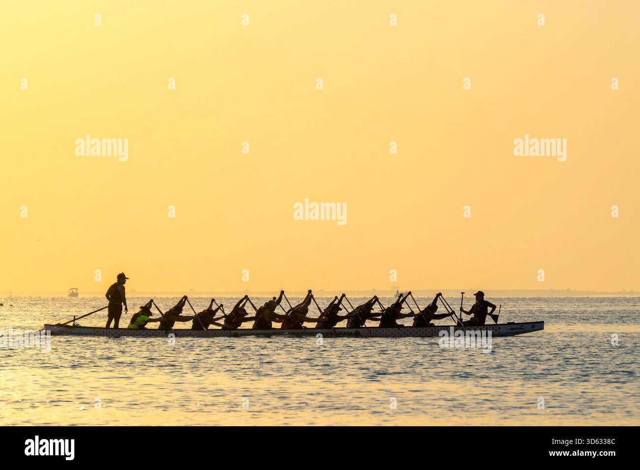 Doha, Qatar - October 24, 2025: Silhouette people rowing dragon boat at ...