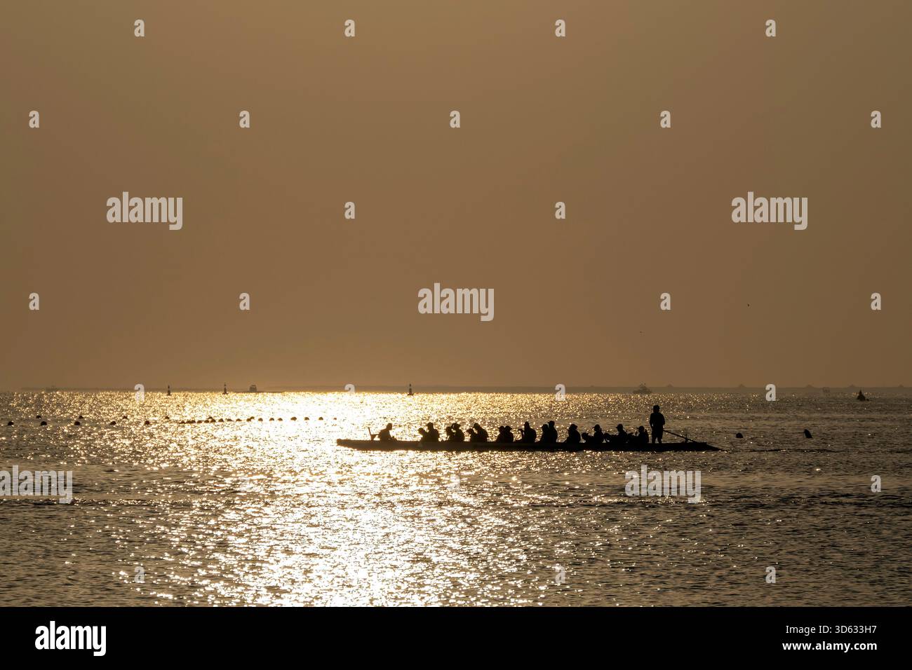 Doha, Qatar - October 24, 2025: Silhouette people rowing dragon boat at ...