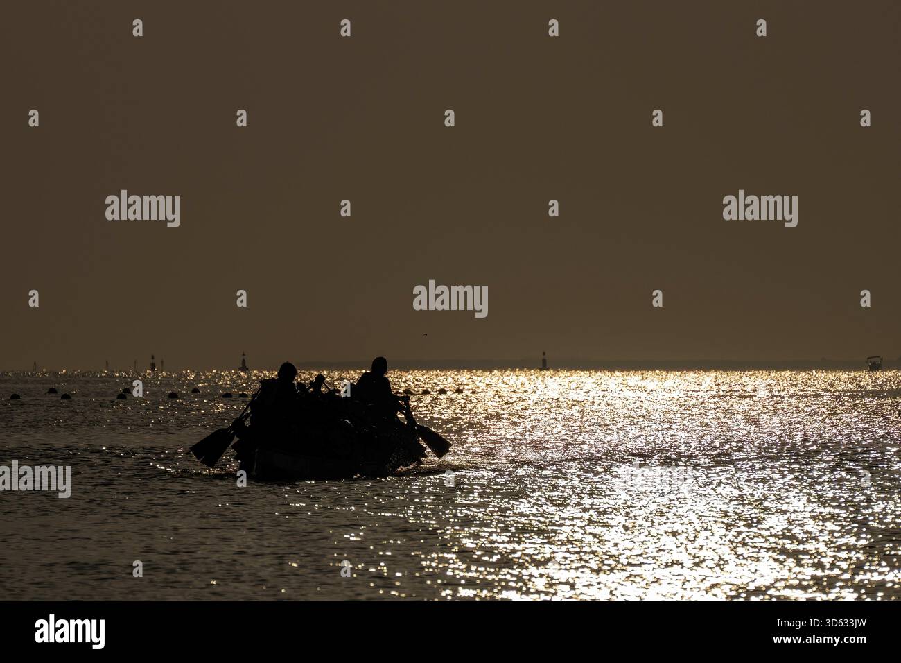 Doha, Qatar - October 24, 2025: Silhouette people rowing dragon boat at ...