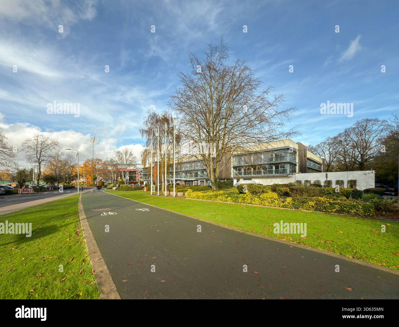 Sport Wales National Centre in Cardiff framed by vibrant autumn foliage on a bright November day in Bute Park, South Wales: Phillip Roberts - Smartphone Captured Stock Image