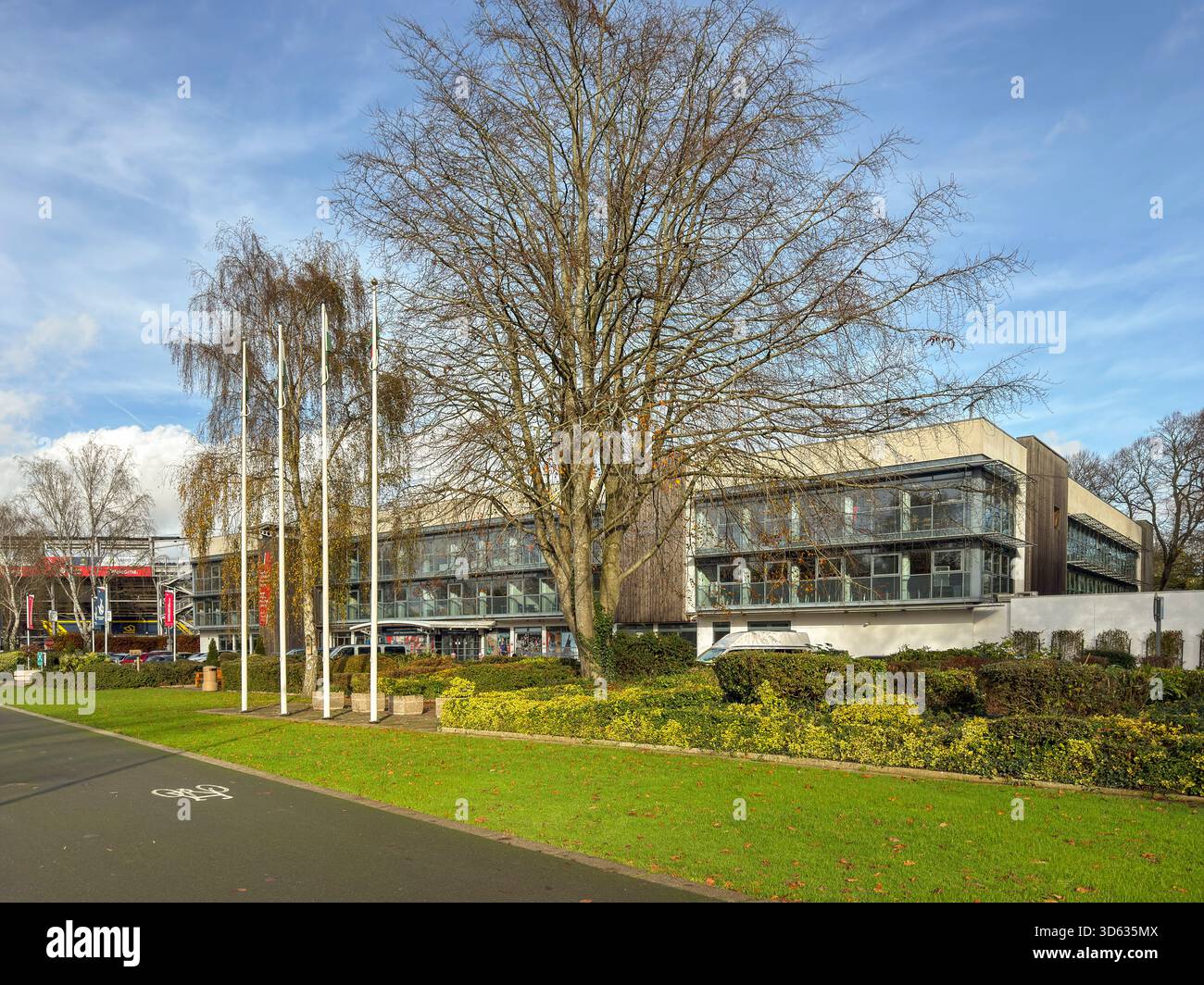 Sport Wales National Centre in Cardiff framed by vibrant autumn foliage on a bright November day in Bute Park, South Wales: Phillip Roberts - Smartphone Captured Stock Image