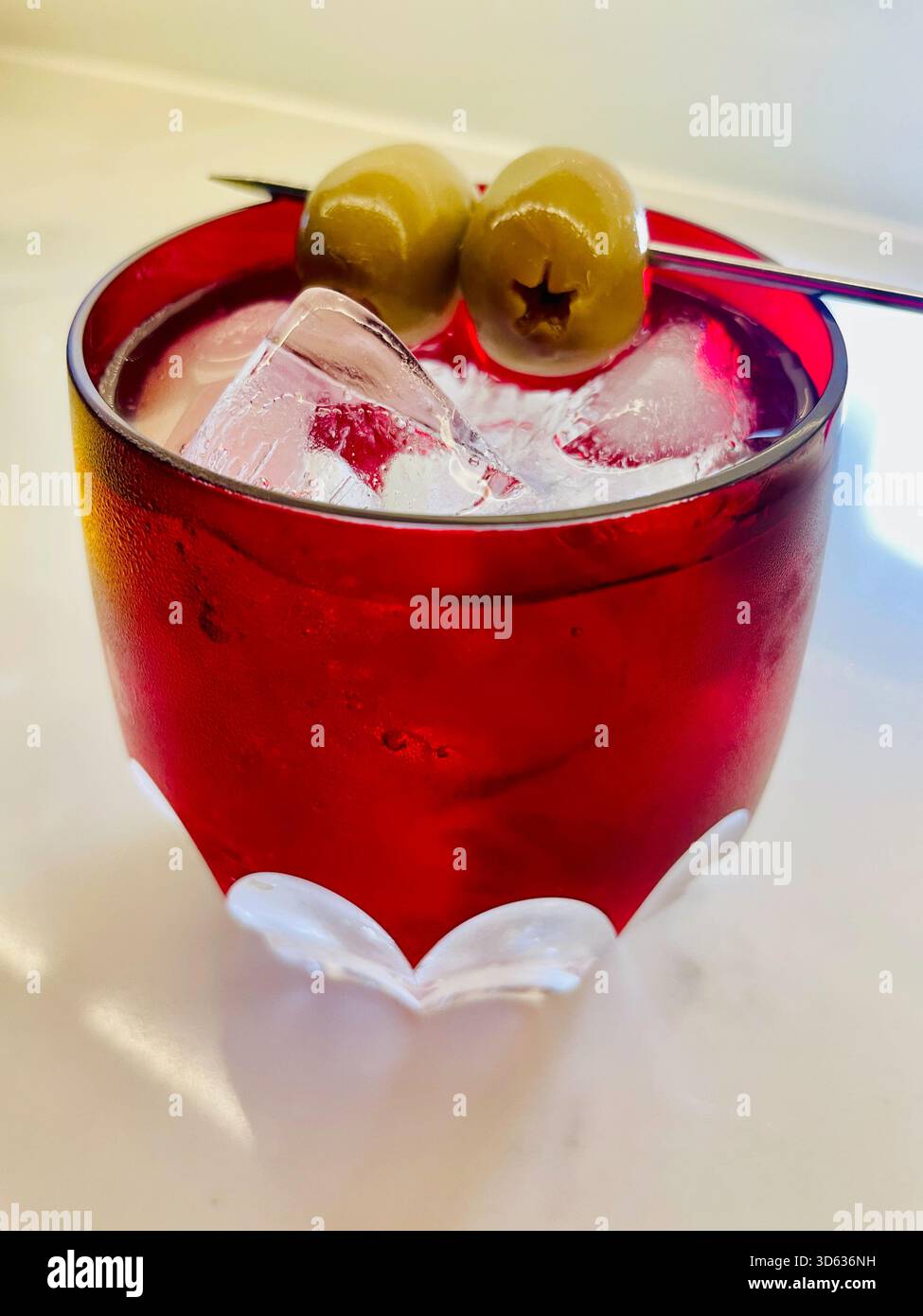 On the rocks vodka martini sits in the rays of sunset in a Waterford crystal glass, 2025, United States, New York City - Smartphone Captured Stock Image