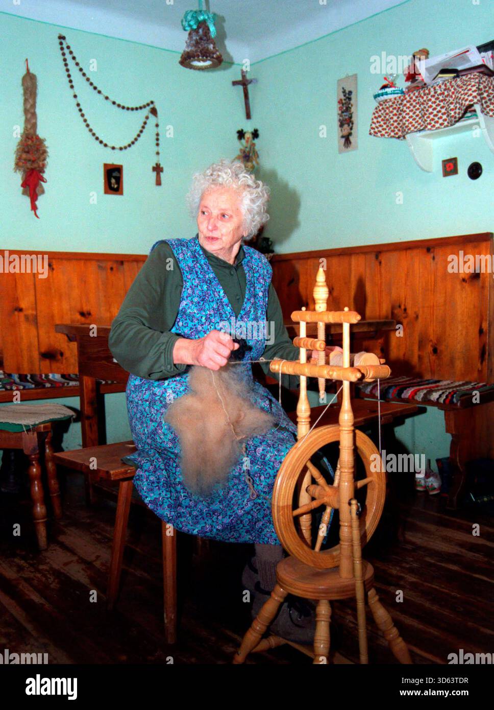 traditional wool spinning on a spinning wheel, fashion and design ...