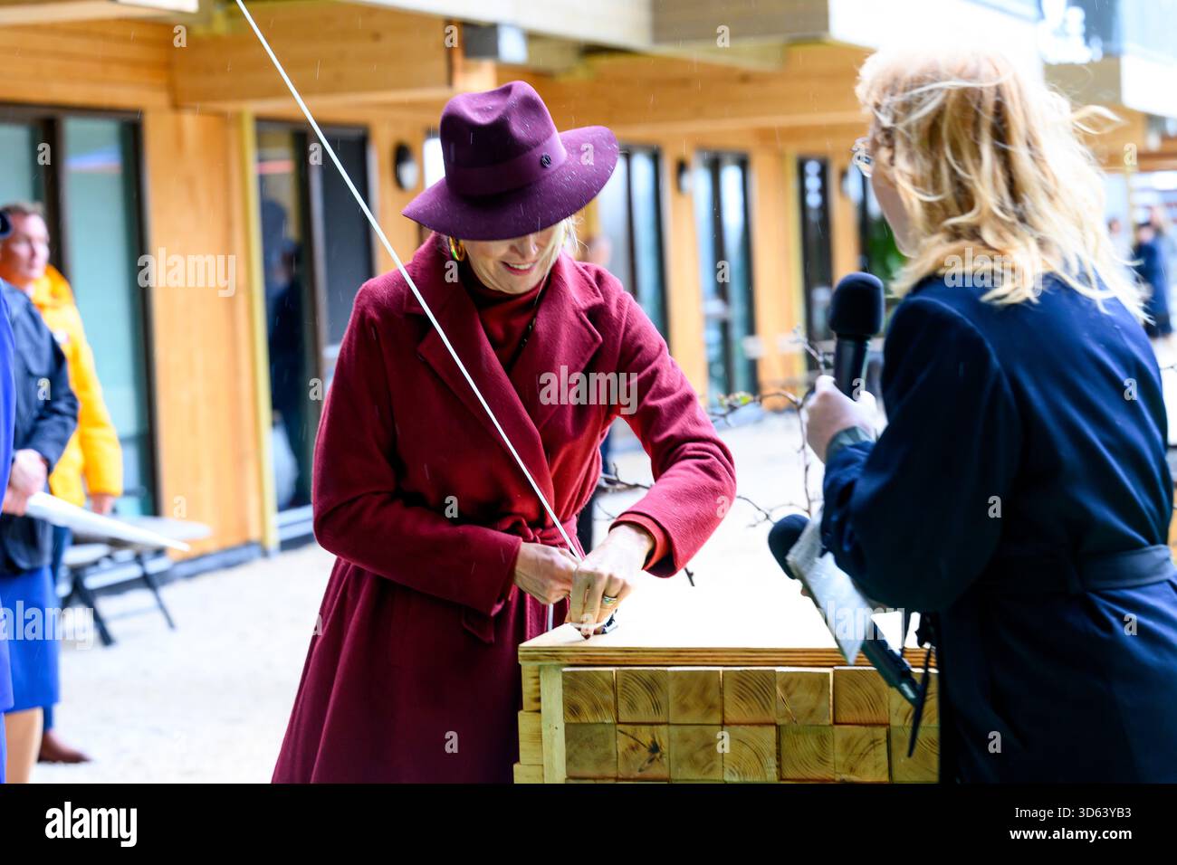 Queen Maxima at the opening of the circular wooden residential building ...