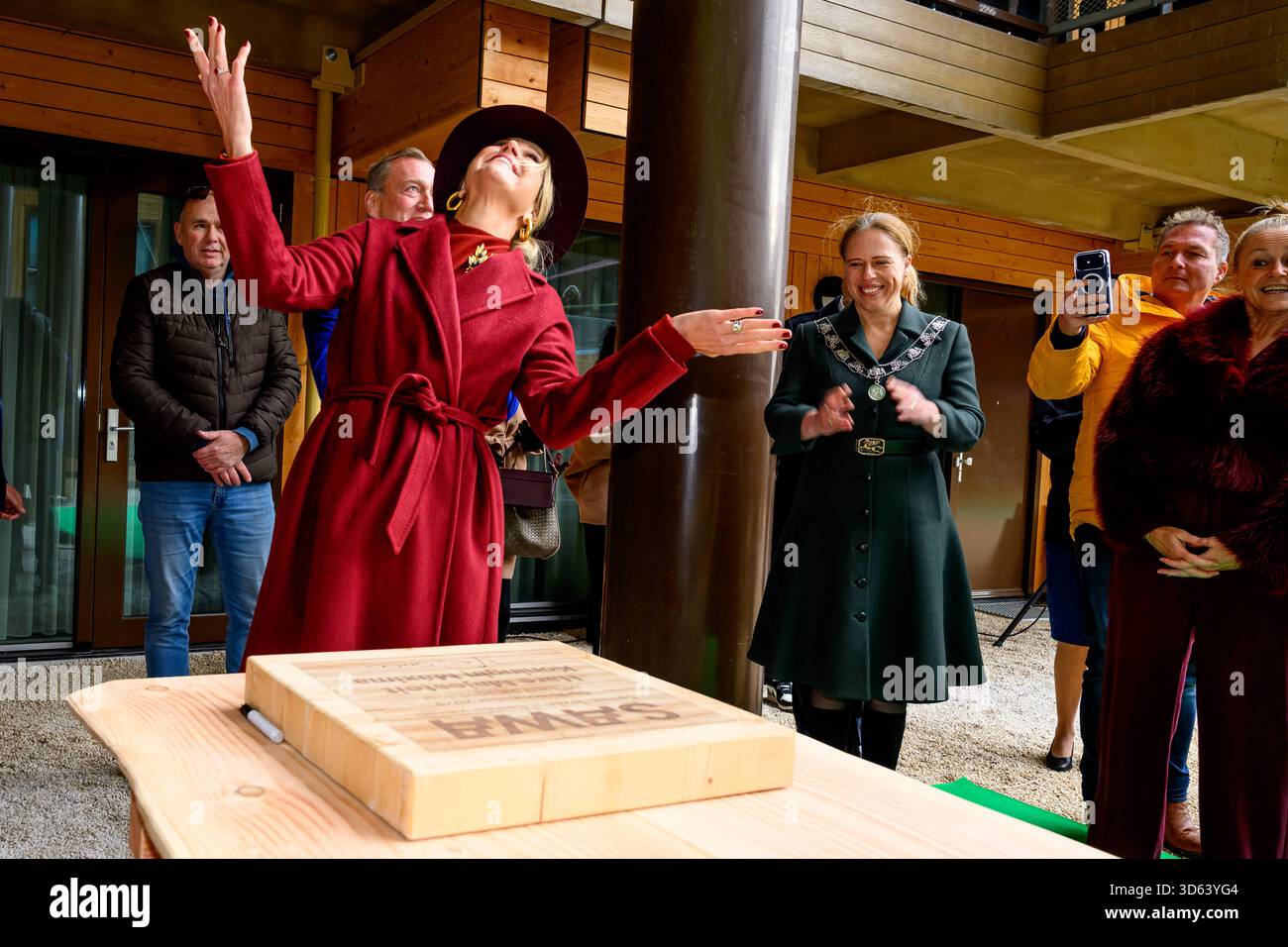 Queen Maxima at the opening of the circular wooden residential building ...