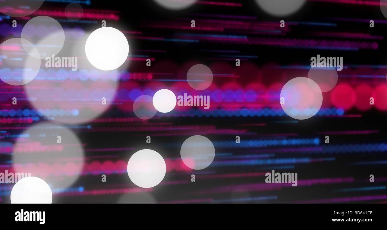 Shimmering bokeh circles and colored light streaks creating abstract studio background with grain Stock Photo