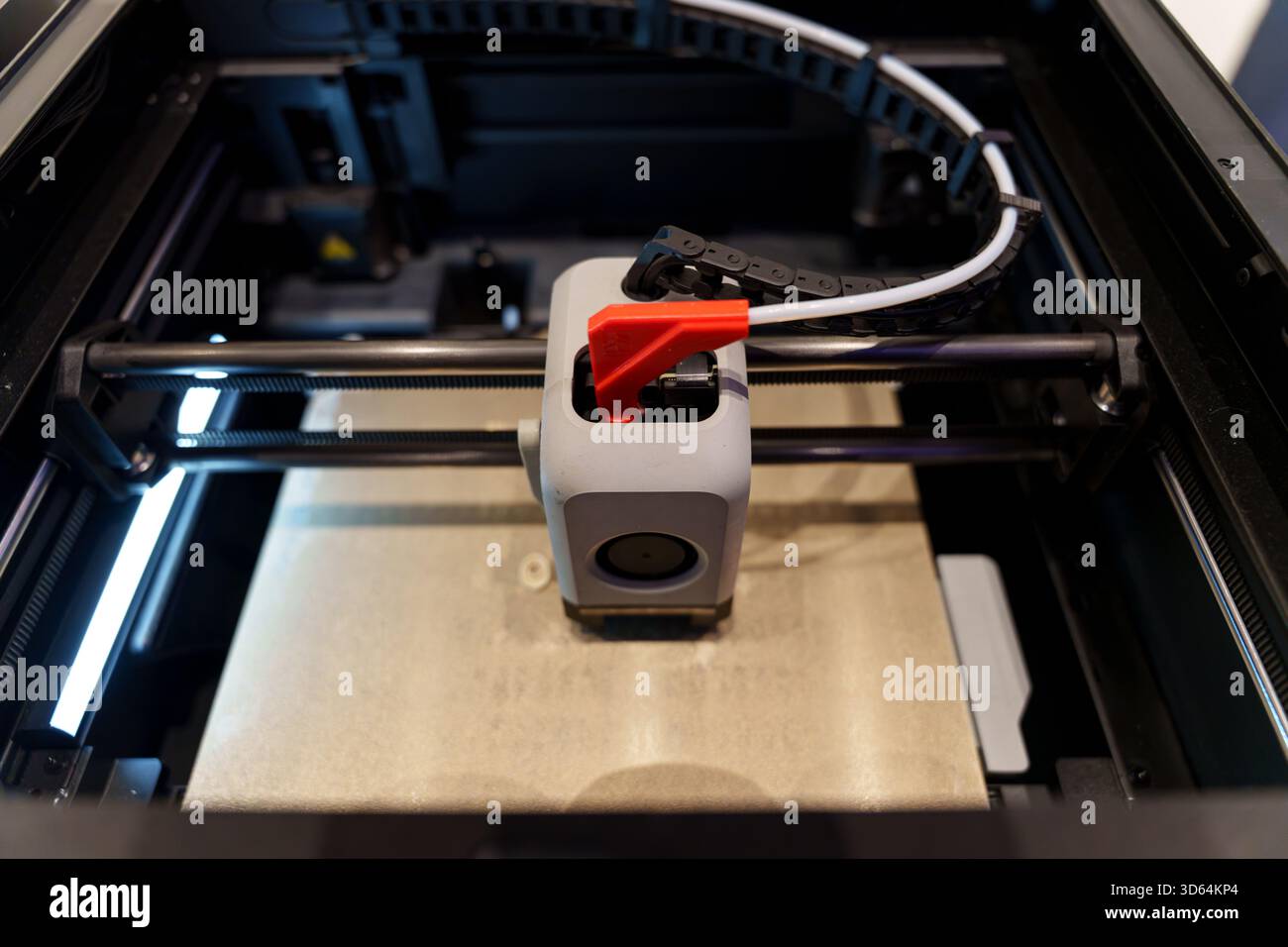 Printer Head Guid Rails A top-down view of a 3D printer in operation, clearly showing the print ...