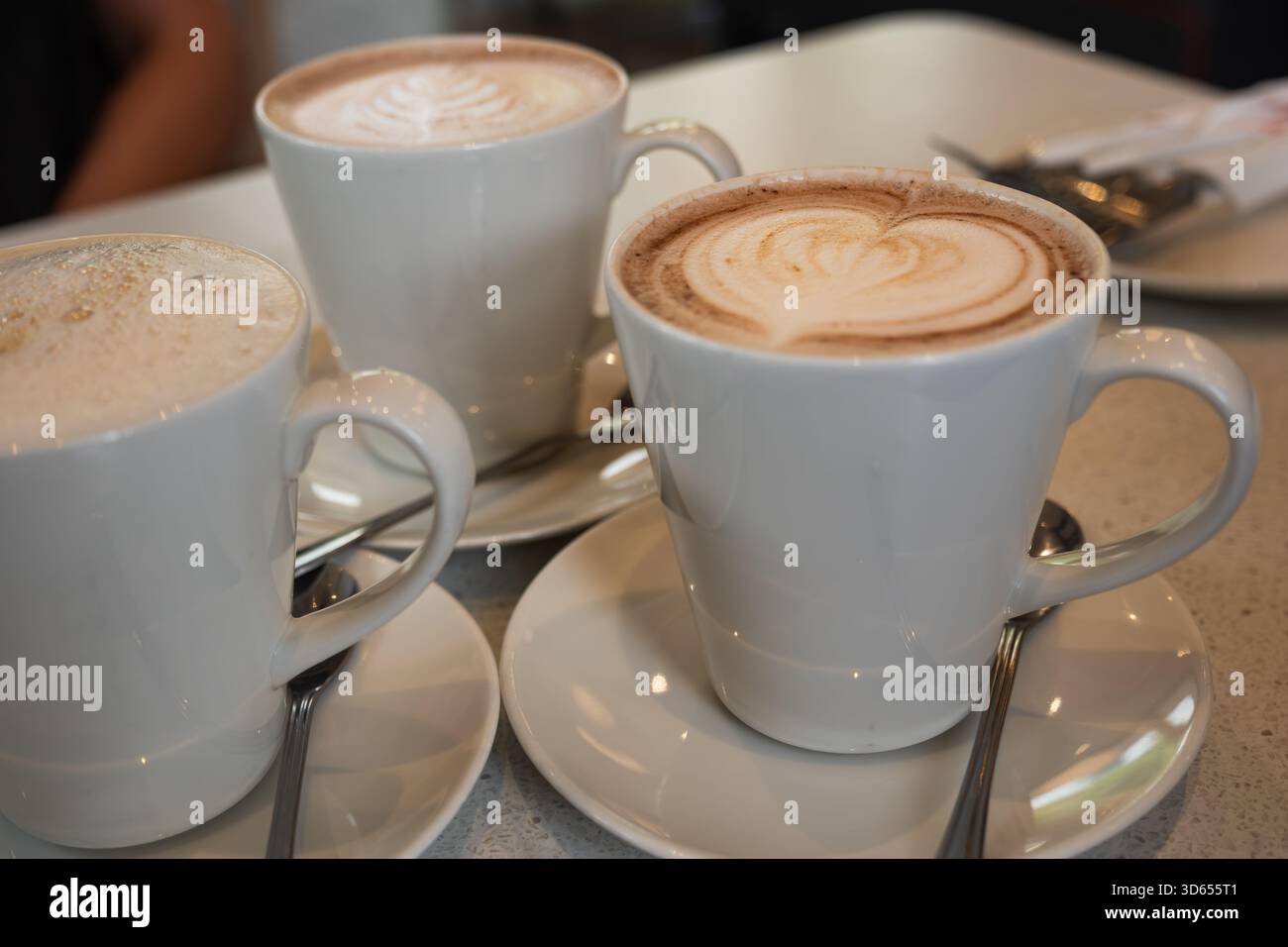 Coffee art three cups cappuccino hi-res stock photography and images - Alamy