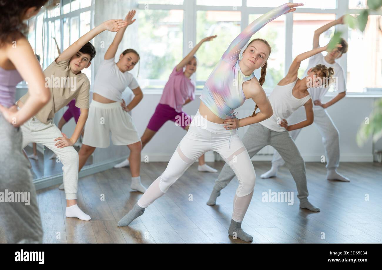 Group of children warming up before dance class Stock Photo