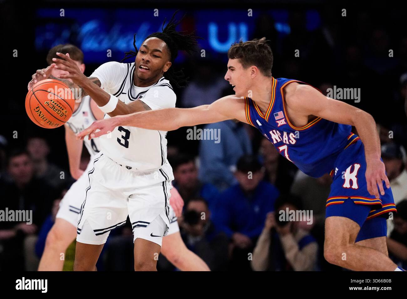 Kansas' Kohl Rosario, right, knocks the ball away from Duke's Isaiah ...