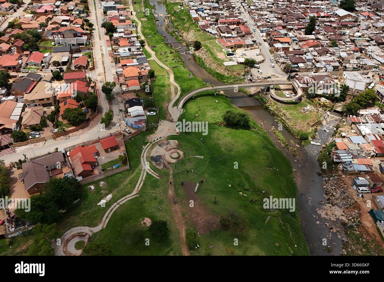 An Aerial View Of The Jukskei River In The Alexandra Township In an-aerial-view-of-the-jukskei-river-in-the-alexandra-township-in