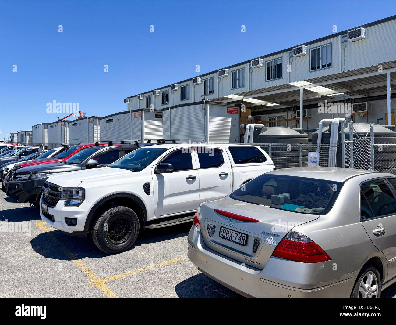 Australia construction building site construction portacabin offices and staff cars parked outside - Smartphone Captured Stock Image