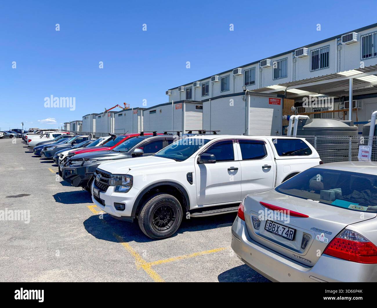 Australia construction building site construction portacabin offices and staff cars parked outside - Smartphone Captured Stock Image