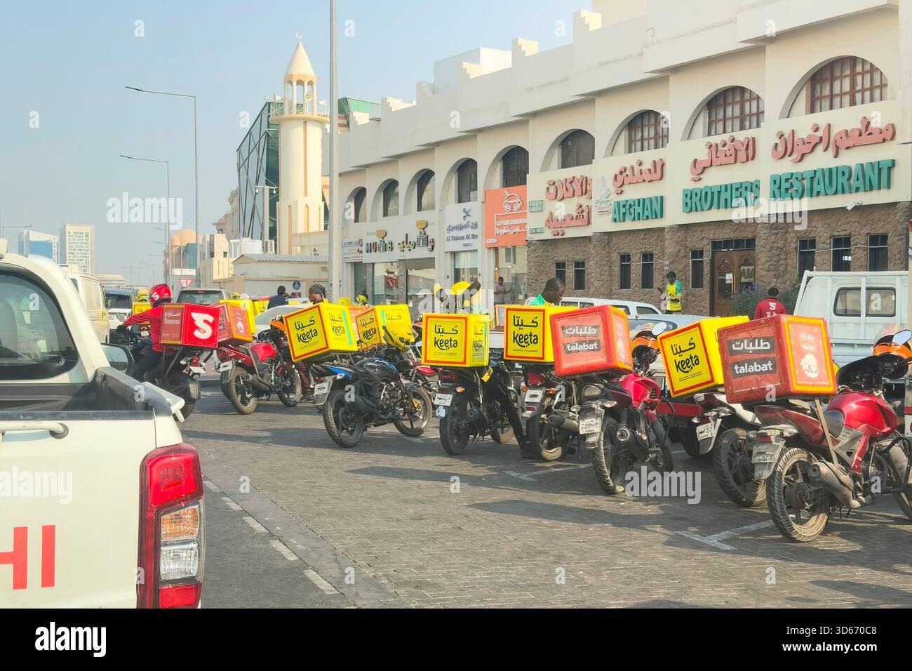 Doha, Qatar - November 14, 2025: Keeta riders, food delivery using bike ...