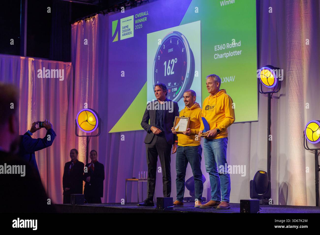A representative of LXNAV receives an award for the E360 Round ...