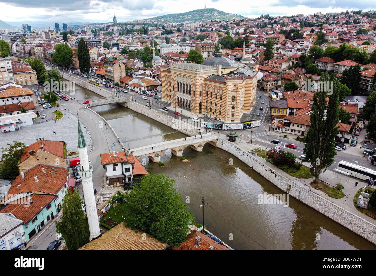 Aerial view of the Miljacka River winding through Sarajevo, framed by ...