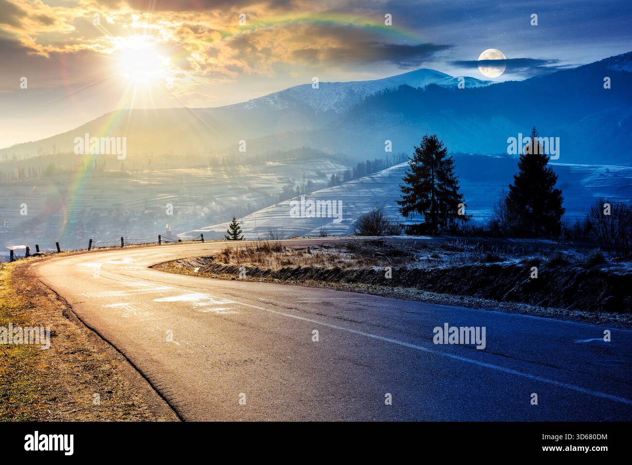 country road in mountains. day and night time change concept. beautiful countryside landscape in late autumn. fir trees on the roadside with sun and m Stock Photo