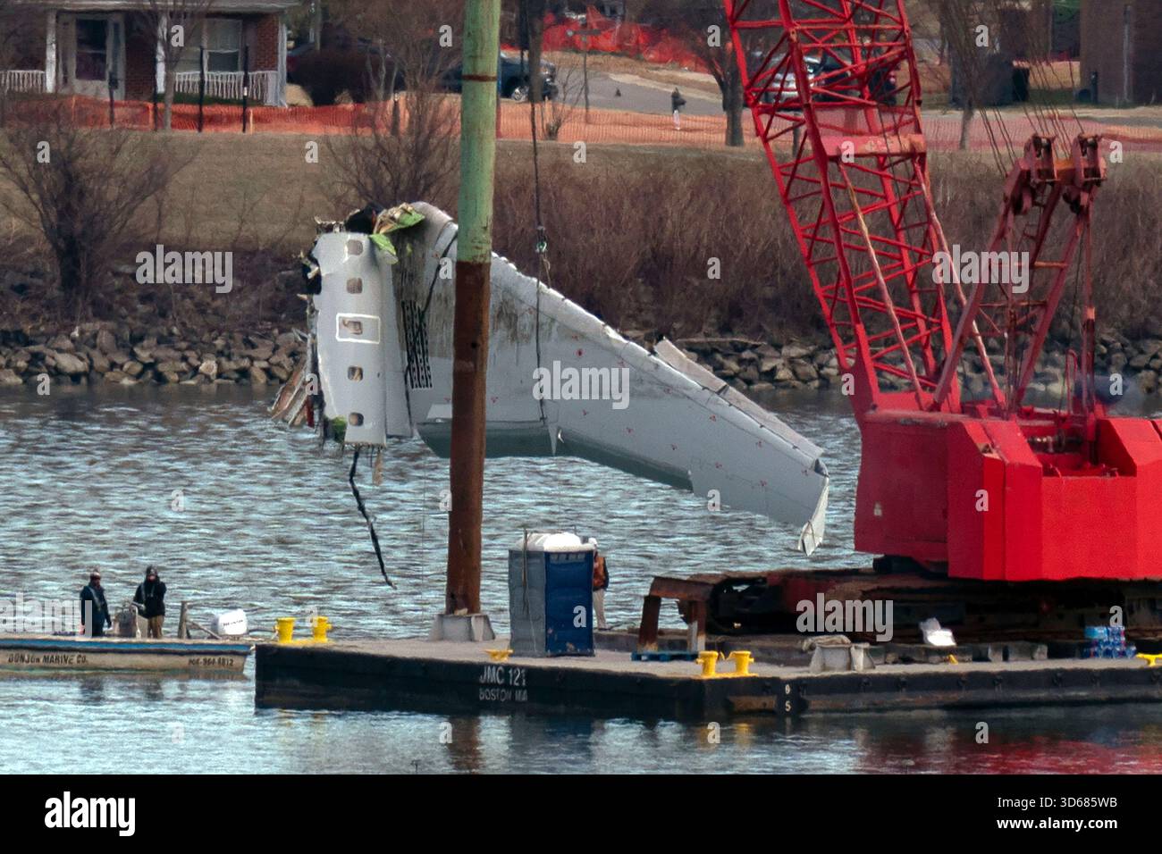 FILE - Rescue and salvage crews pull up airplane wreckage of an ...