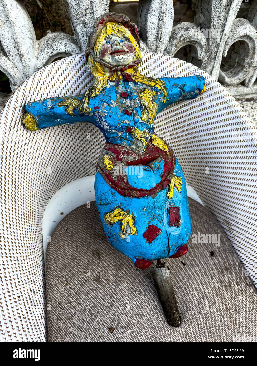 Scary Cement Garden Doll Crafted from Durable Materials in a Natural Sustainable Garden Setting: Phillip Roberts - Smartphone Captured Stock Image