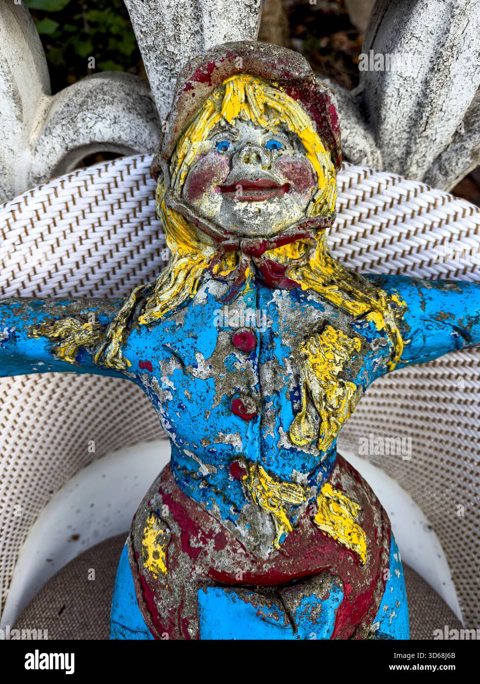 Scary Cement Garden Doll Crafted from Durable Materials in a Natural Sustainable Garden Setting: Phillip Roberts - Smartphone Captured Stock Image