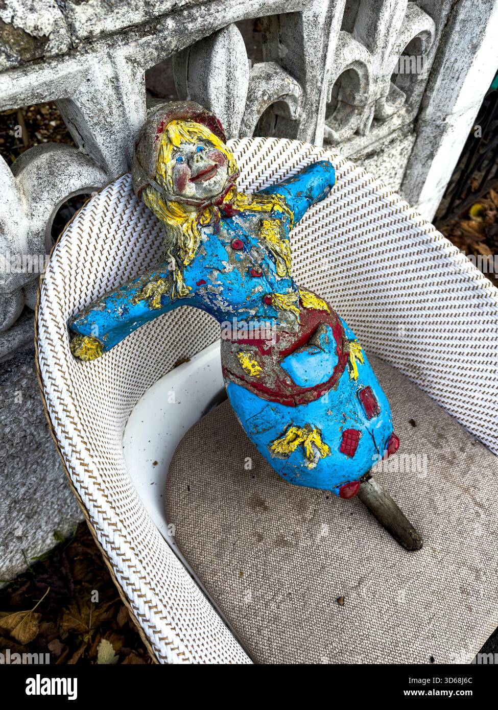 Scary Cement Garden Doll Crafted from Durable Materials in a Natural Sustainable Garden Setting: Phillip Roberts - Smartphone Captured Stock Image