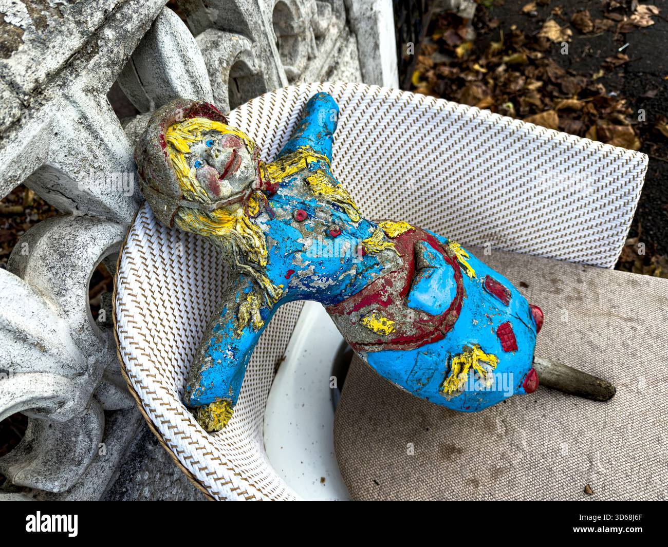Scary Cement Garden Doll Crafted from Durable Materials in a Natural Sustainable Garden Setting: Phillip Roberts - Smartphone Captured Stock Image