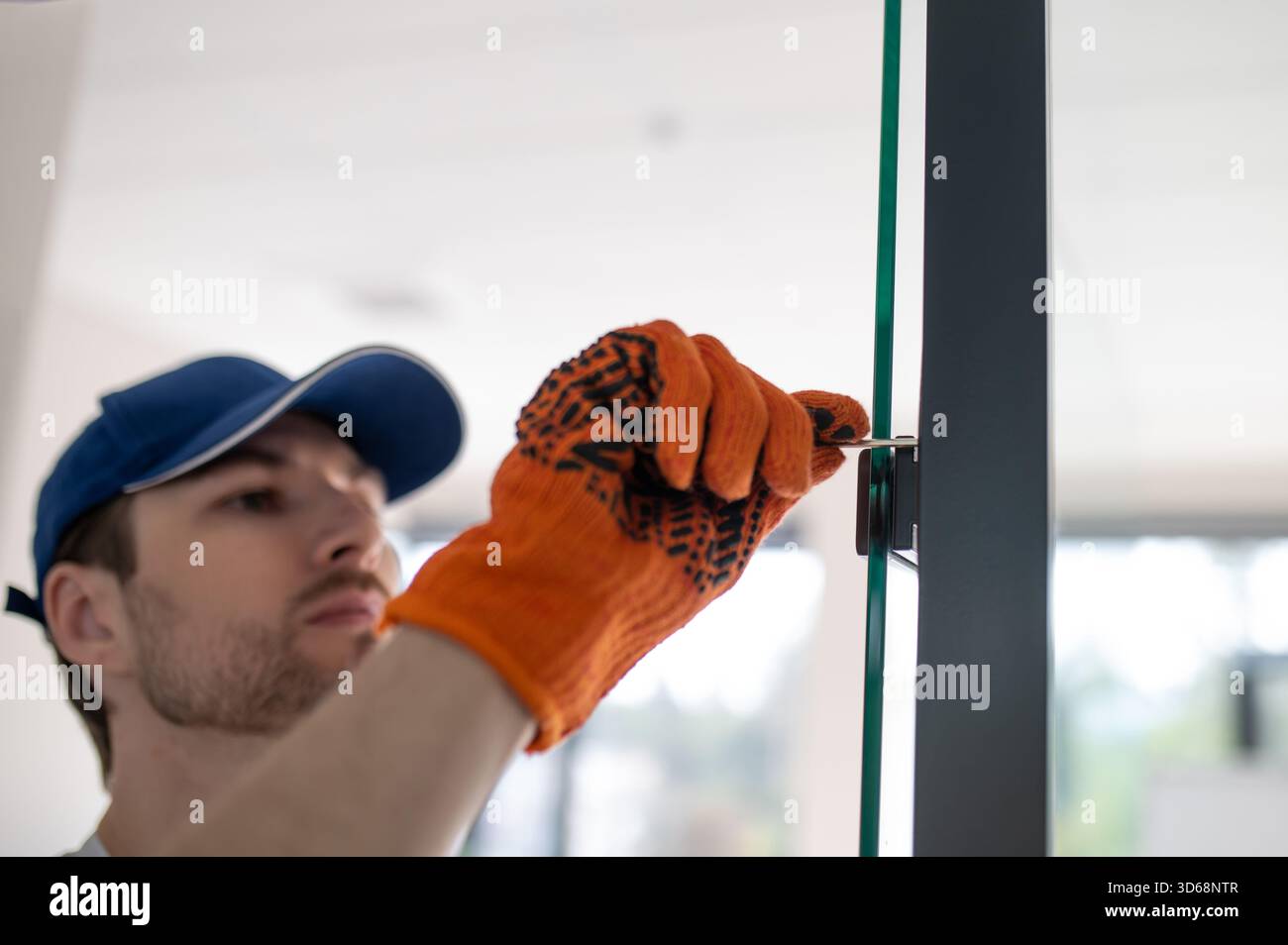 Installing glass partition hi-res stock photography and images - Alamy