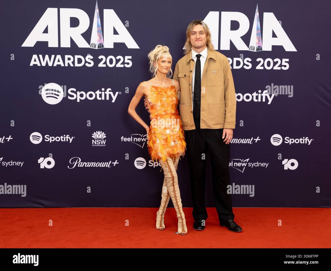 Darcy Moore and Dee Salmin pose for a photo during the 2025 ARIA Awards