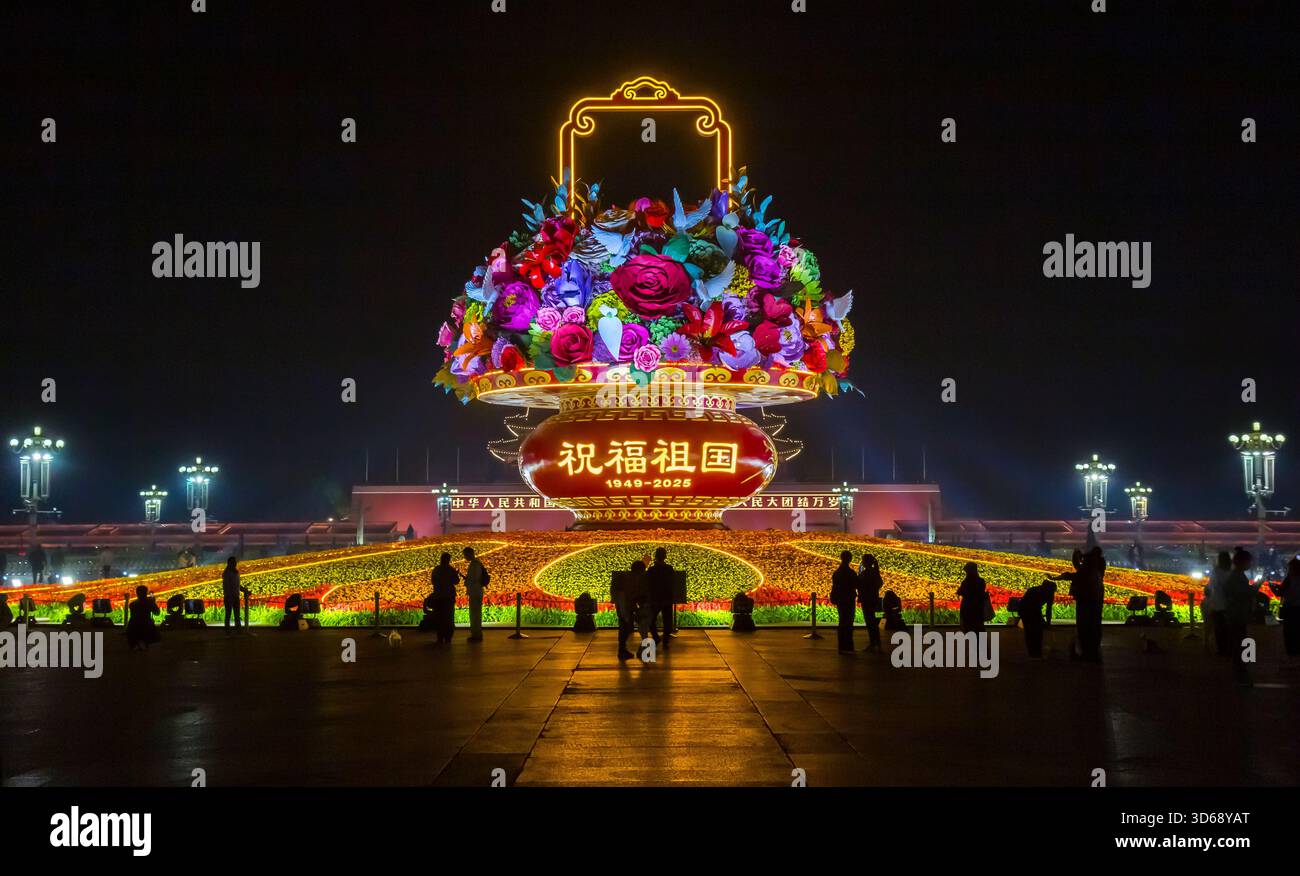 People at night at the illuminated festive flower basket in Beijing, China Stock Photo