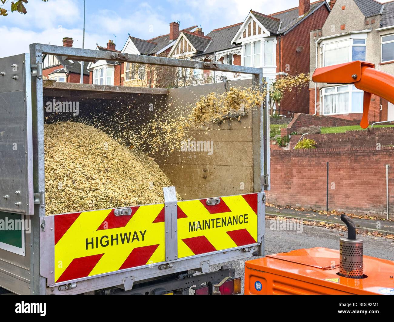 Tree Chipper Processing Branches During Roadside Arboricultural Work, South Wales, UK: Phillip Roberts - Smartphone Captured Stock Image