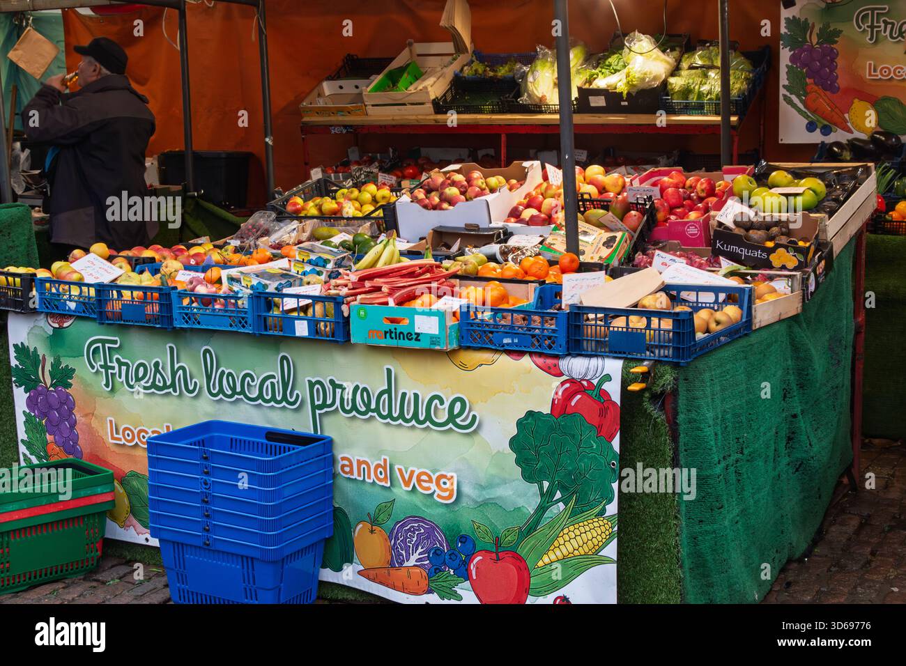 Outdoor market stall displaying a variety of fresh fruits and ...